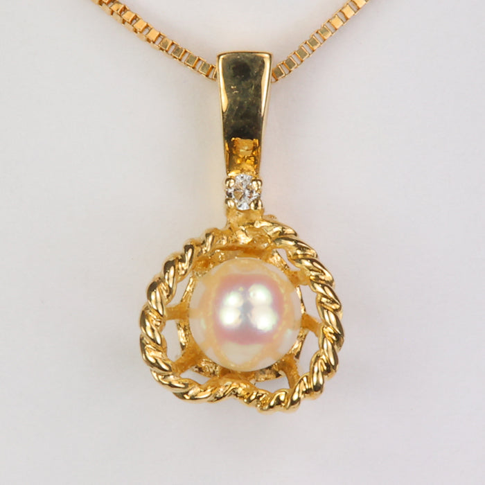 yellow gold pearl in basket with diamond accent pendant