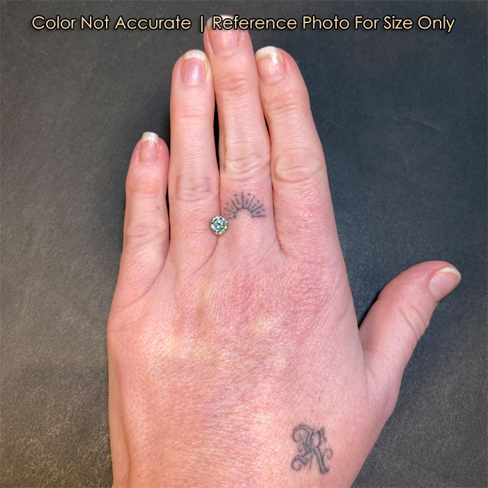 round brilliant natural sapphire on hand