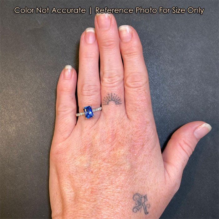 natural sapphire ring in white gold with diamonds on a hand