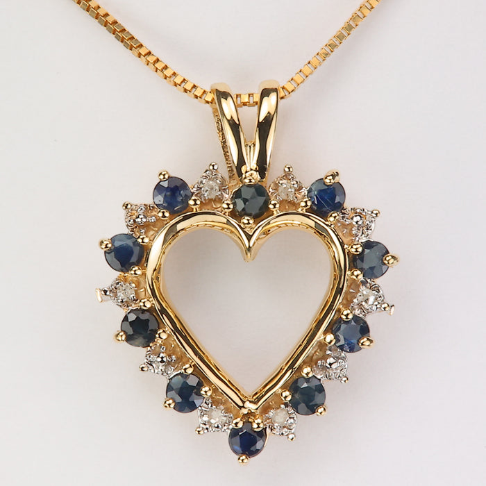 gold and sapphire heart pendant with diamonds