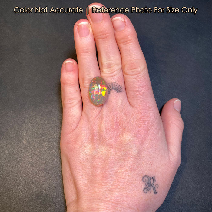 oval cut opal gem size to a hand