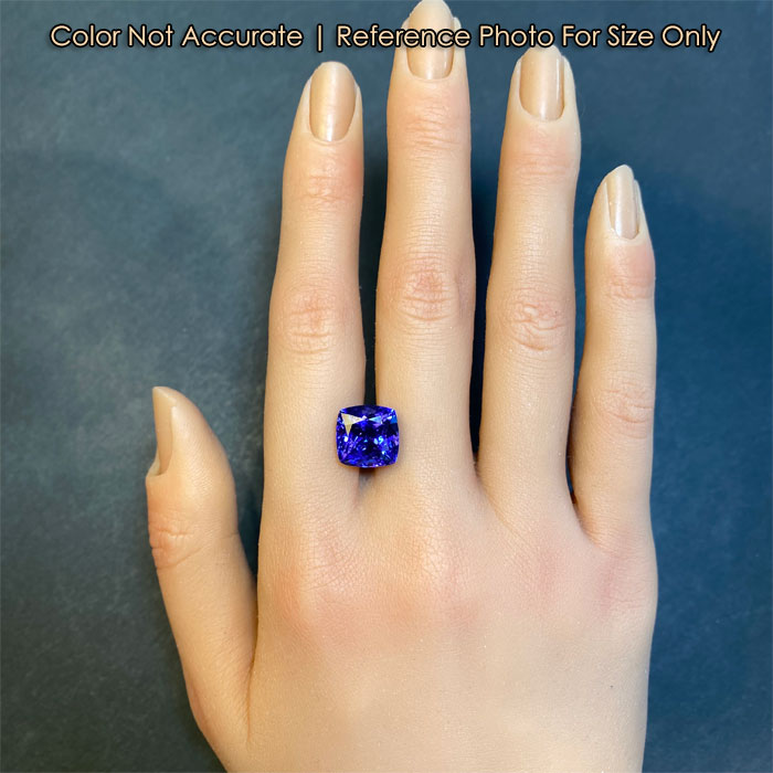 square cushion tanzanite gemstone on hand reference