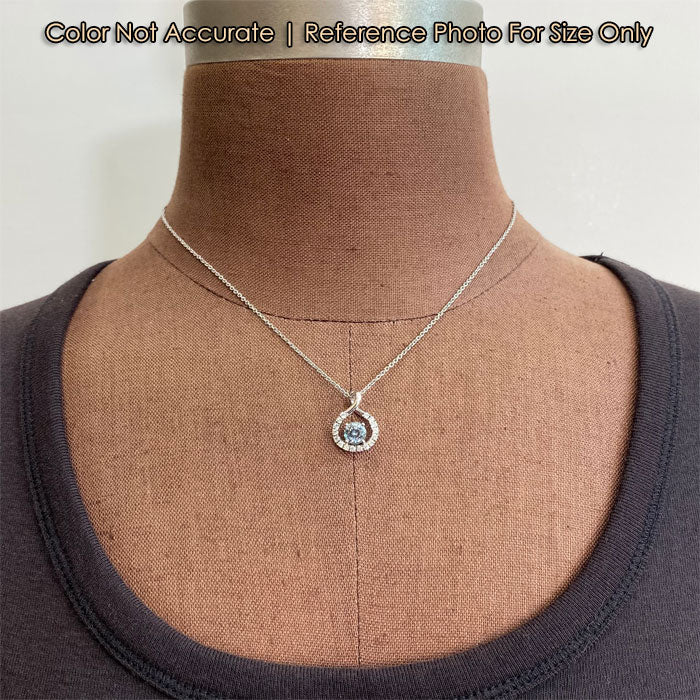 white gold and montana sapphire pendant with diamonds