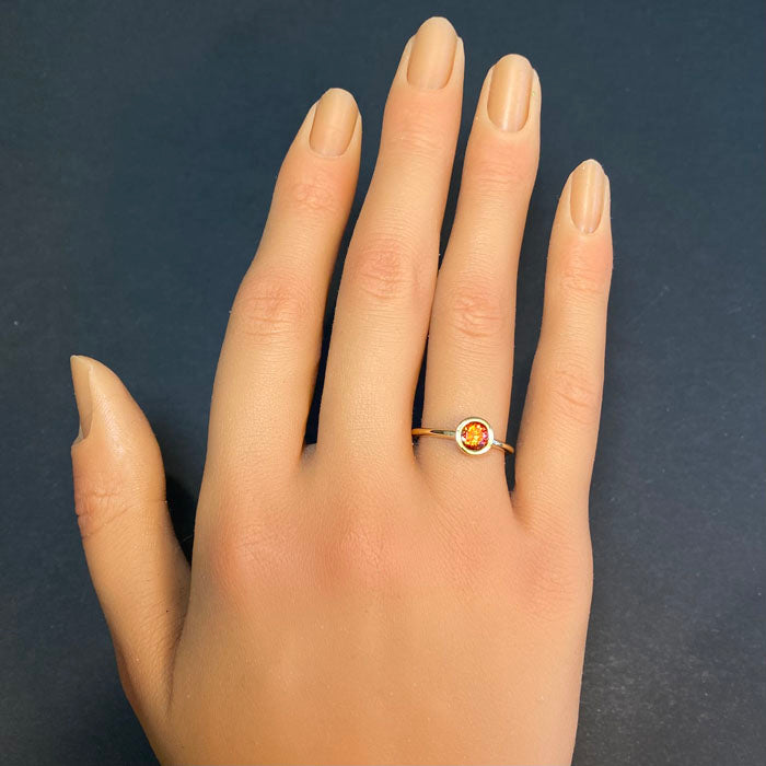 yellow gold bezel set spessartite garnet ring