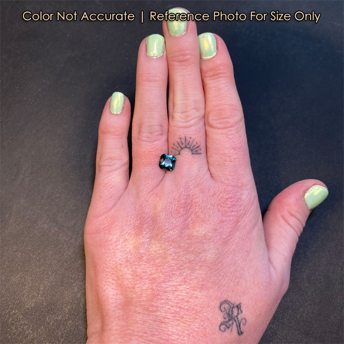 green blue sapphire gem on hand square cushion cut