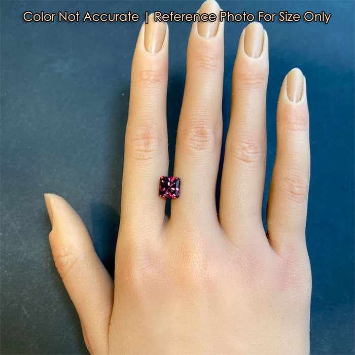 rhodolite garnet gemstone on hand 