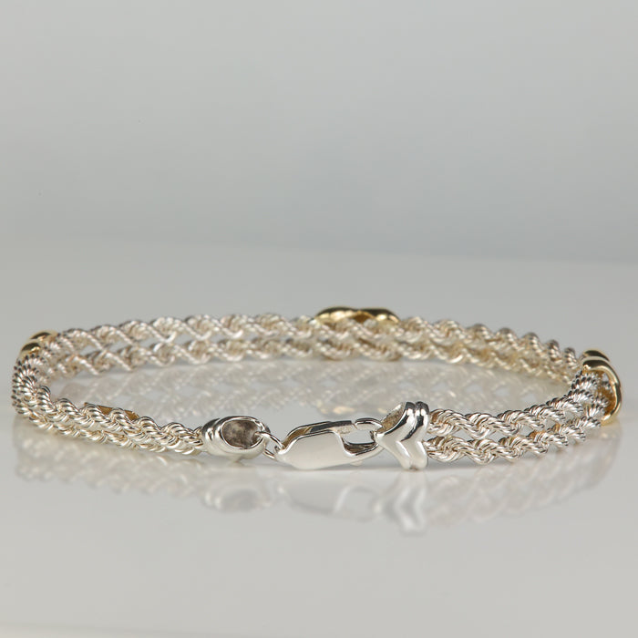 clasp on sterling and yellow gold bracelet