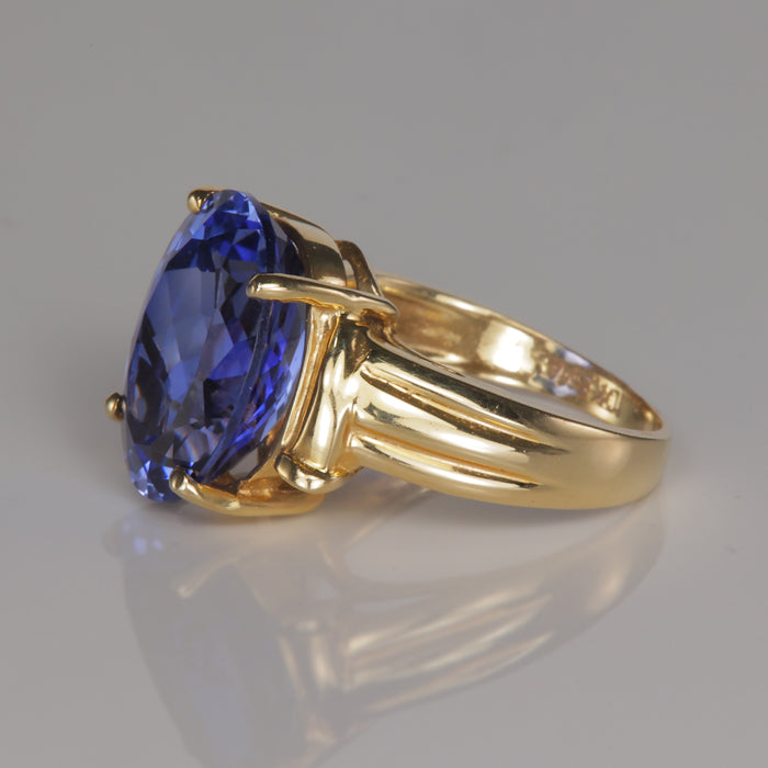 yellow gold estate ring with blue synthetic sapphire gem