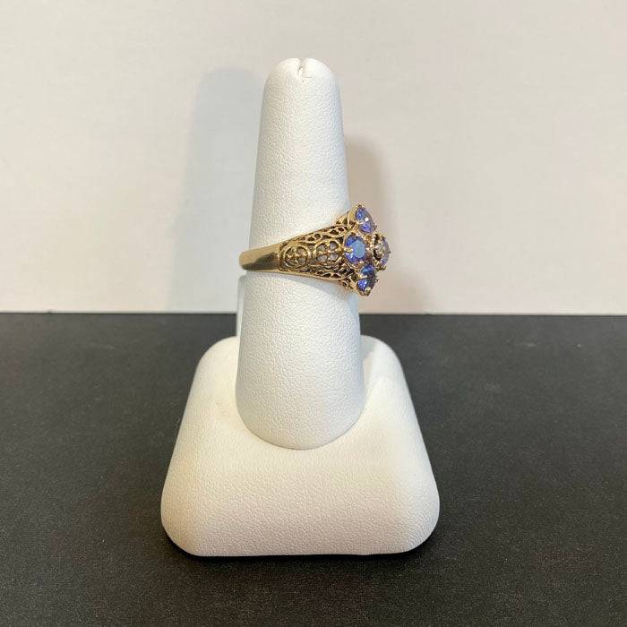 yellow gold filigree ring with tanzanites and diamond