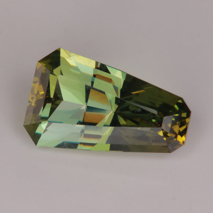 blue green tapered barion cut fancy tanzanite