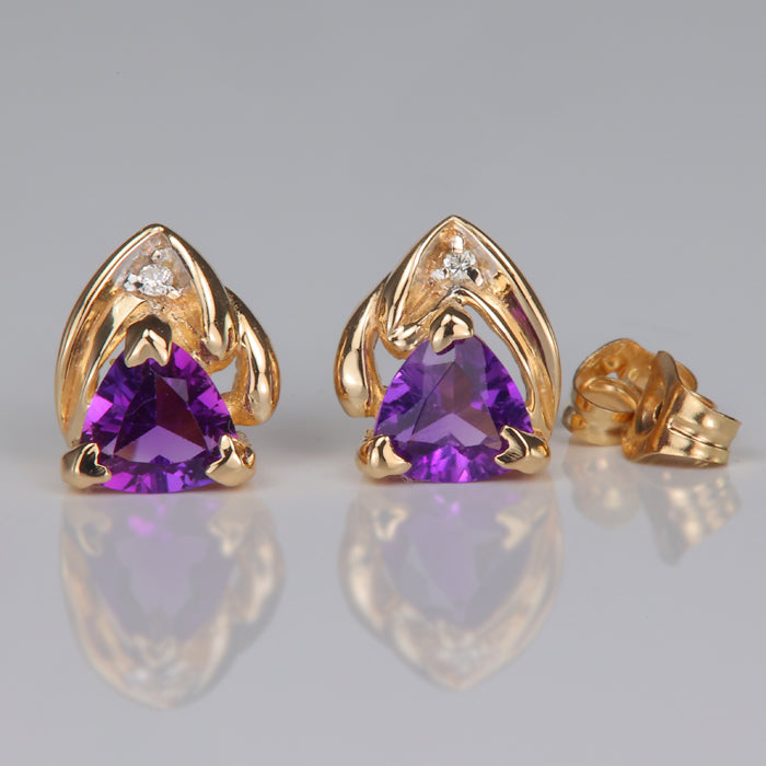 purple color trilliant cut amethyst and diamond stud earrings in yellow gold 