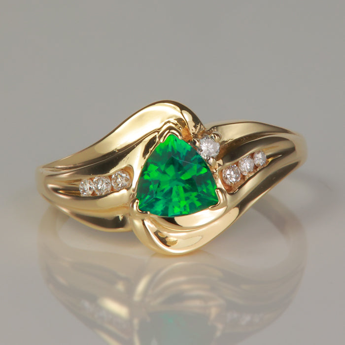 yellow gold trilliant cut gemstone ring with diamonds