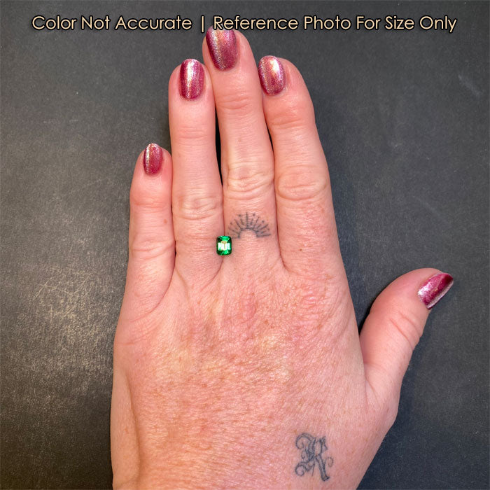 emerald cut tsavorite garnet on hand size
