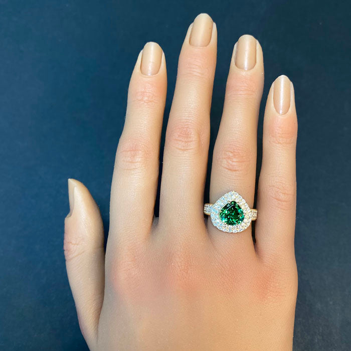 tsavorite garnet ring in yellow gold with diamonds