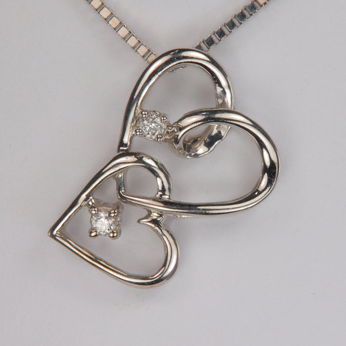 estate heart pendant in white gold with diamond accents 