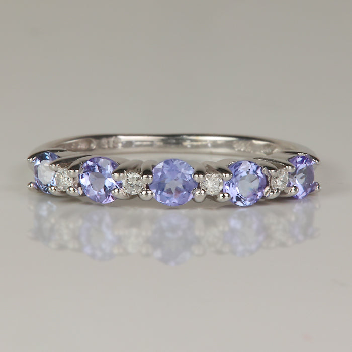 round brilliant cut tanzanite gemstone ring in white gold with diamonds