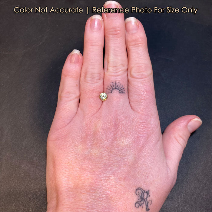 round brilliant cut natural sapphire on hand 