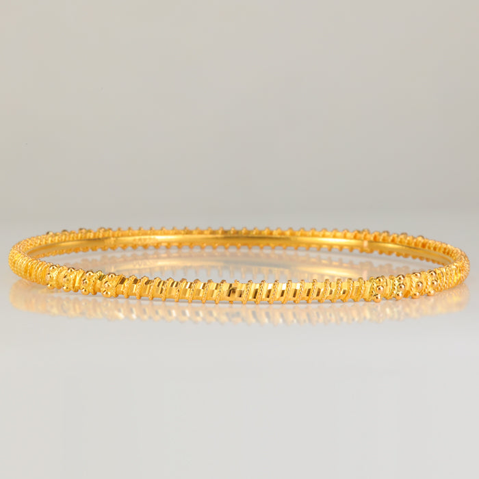 22k yellow gold bangle bracelet with diamond cut and bead details 