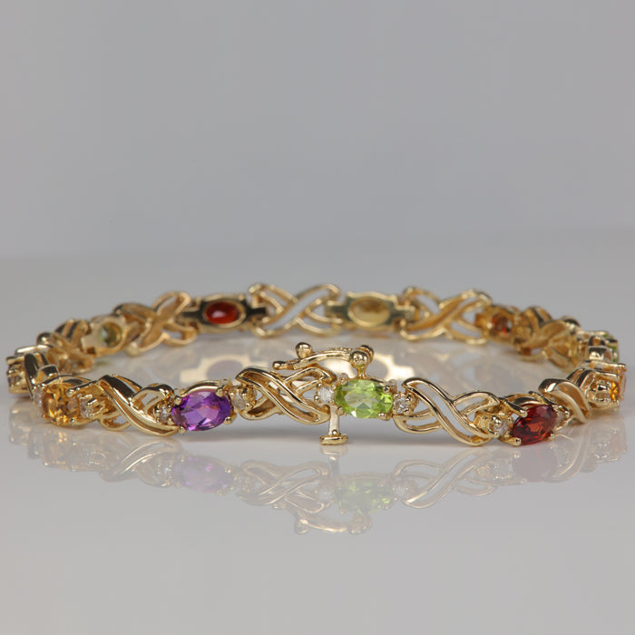 estate bracelet with oval cut garnet peridot citrine and amethyst and diamonds
