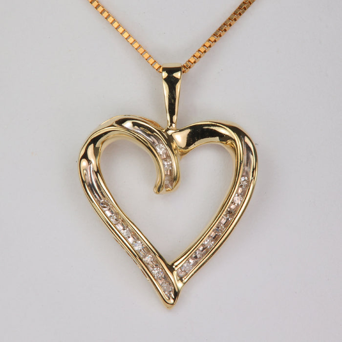 estate heart pendant in yellow gold with diamond accents