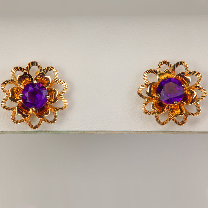 gold diamond cut flower shape earring jackets shown with amethyst studs