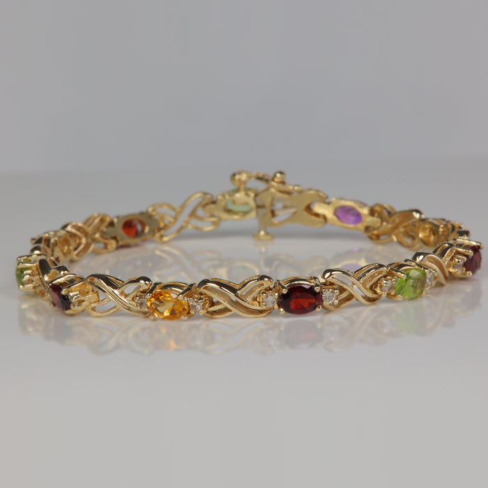 estate bracelet with oval cut garnet peridot citrine and amethyst and diamonds