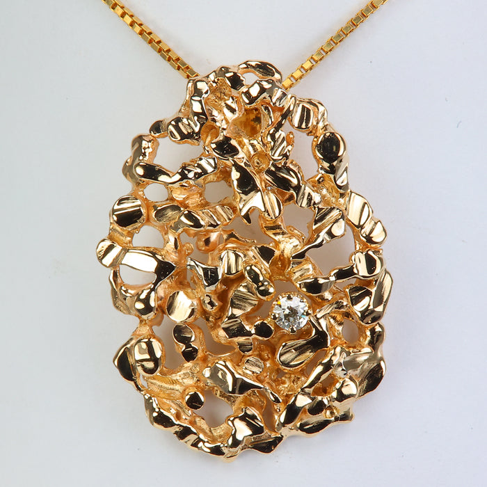 nugget style yellow gold pendant with diamond
