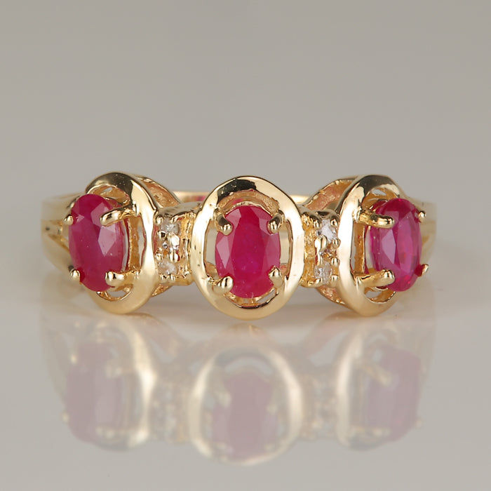 oval cut ruby and diamond ring in yellow gold