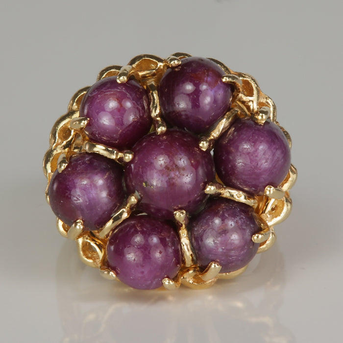 purple color star ruby statement ring in yellow gold