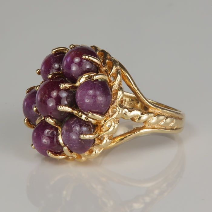 yellow gold gemstone ring with star rubies