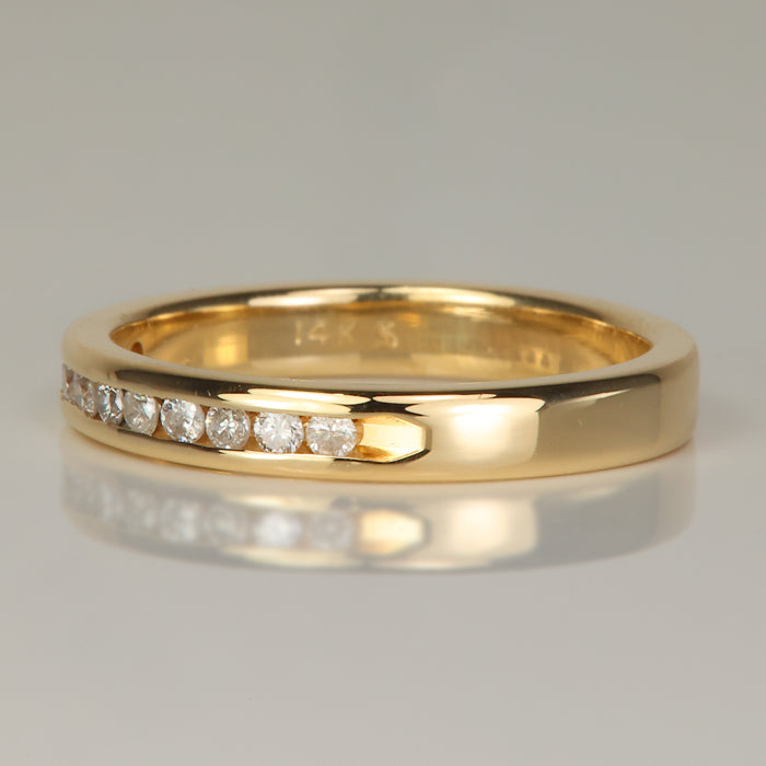 channel set diamond ring in yellow gold