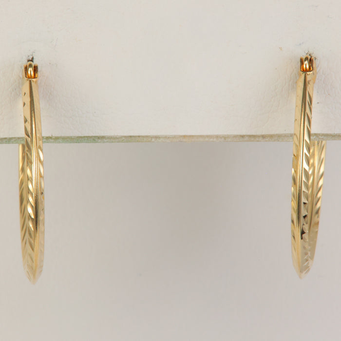 yellow gold hoops with diamond cuts