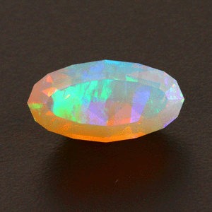 On Hold for Jane Faceted Oval Welo Opal Gemstone 6.65 Carats