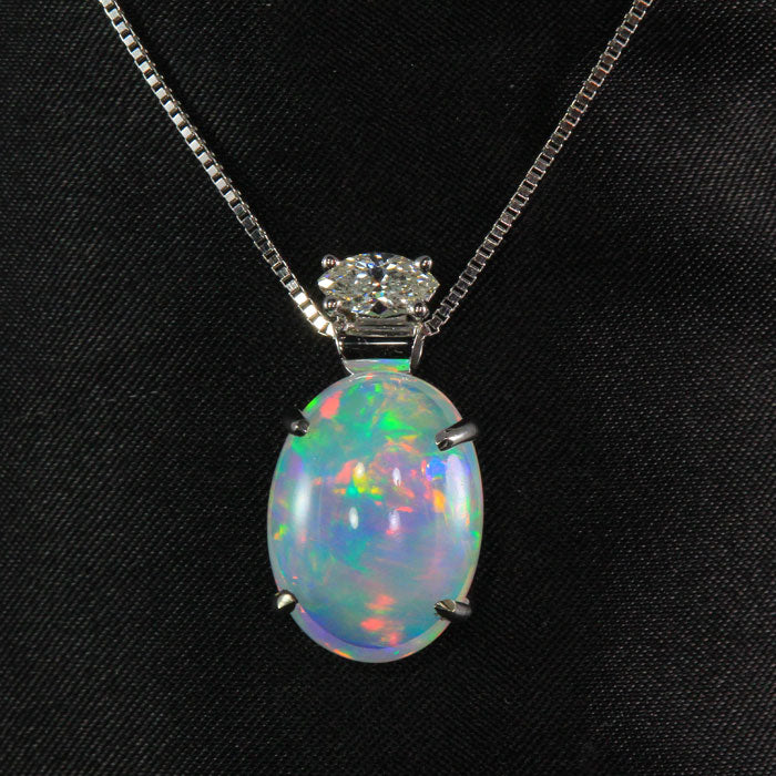 white gold opal oval cabochon and diamond pendant
