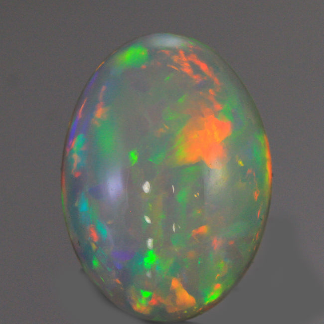 Vivid Flashes Cabochon Oval Welo Opal 6.40 Carats